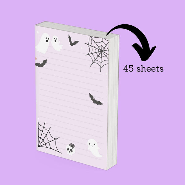 Ghost pages Halloween notepad shown at an angle highlighting its 45-sheet thickness