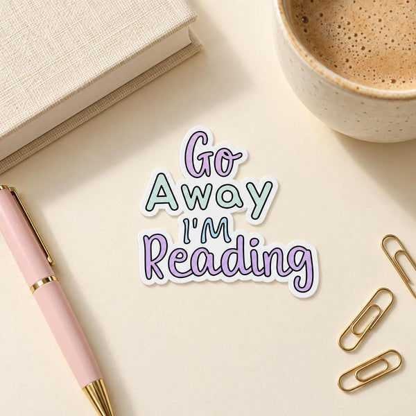 Go Away I'm Reading die-cut sticker with pastel purple and teal lettering