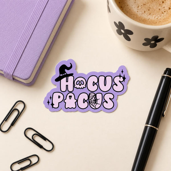 Witchy Halloween die-cut sticker with purple lettering and a black witch hat