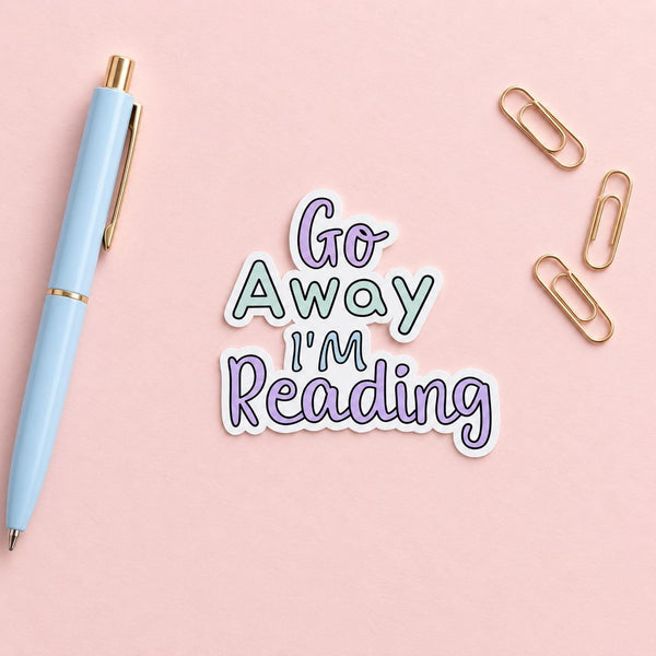 Go Away I'm Reading die-cut sticker with pastel purple and teal lettering — photo 3