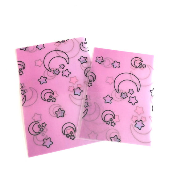 Pink moon and stars laminated vellum sticker pouches for planners, shown closed